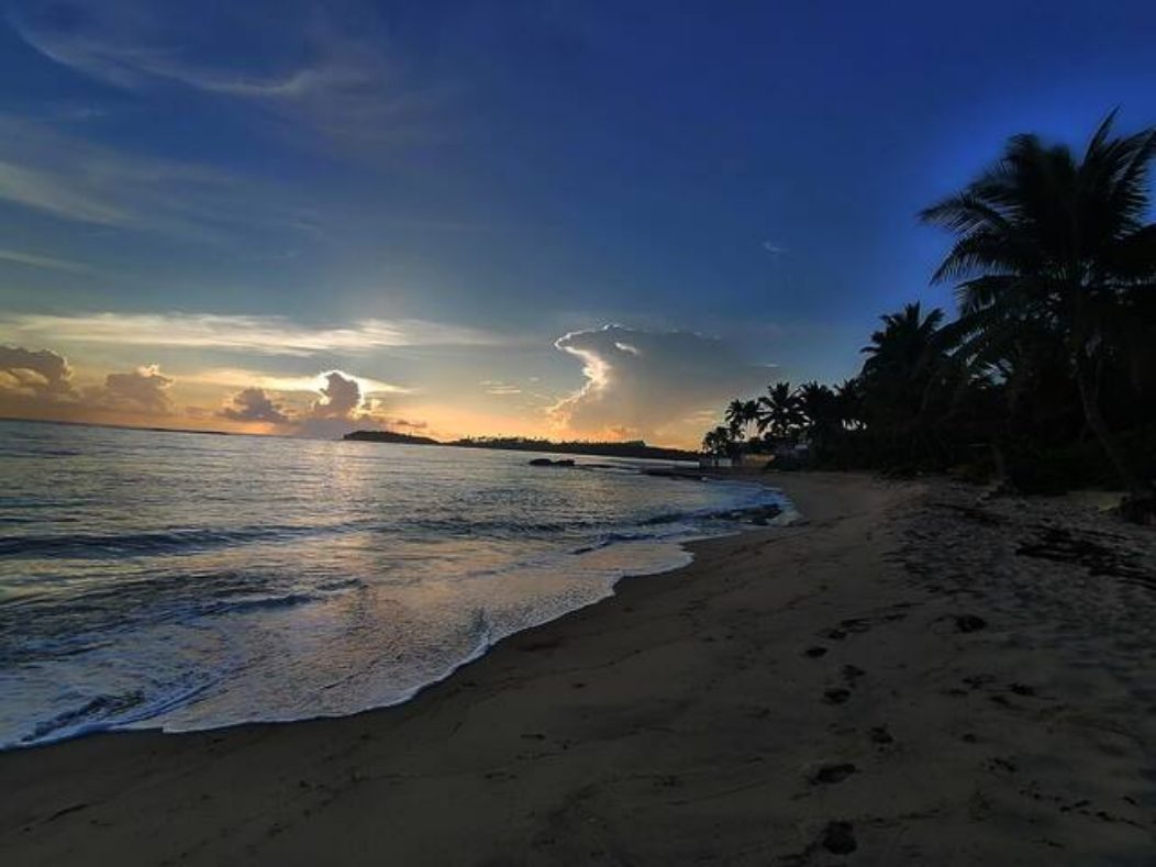 Sunset over the beach at Swamis PR